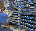 Photo of geologist Kristin Hillis labeling newly retrieved sediment cores in a shipboard lab.