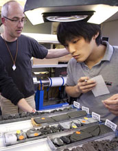 Photo of scientists Michael Stipp and Masaoki Uno choosing samples for analysis.