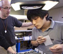 Photo of scientists Michael Stipp and Masaoki Uno choosing samples for analysis.