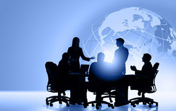 Illustration showing silhouettes sitting at a table with a globe in the background