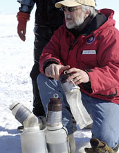 transfering samples collected by divers to waiting vehicle for transport to station lab