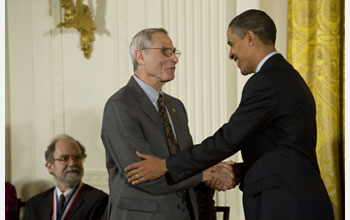 Photo of Michael Posner receiving the National Medal of Science from President Barack Obama.
