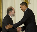 Photo of James Gunn receiving the National Medal of Science from President Barack Obama.