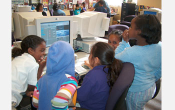 Photo of students using Scratch, an MIT-created programming language for children.