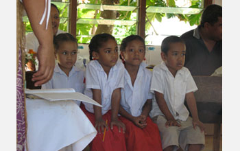 Photo of school children in Tonga in class.