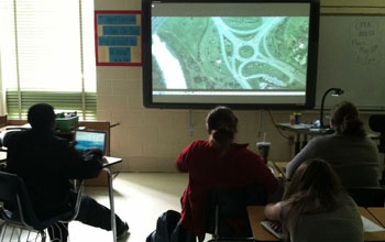 Photo of students watching a transportation construction role model video.