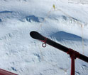 Image looking from a helicopter down to a mapping device in Antarctica.