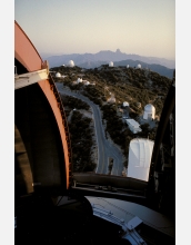 A view of Kitt Peak Mountain as seen through the slit of the 4-meter Mayall Telescope dome