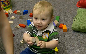 Photo of baby with toy blocks