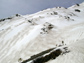 Photo showing zebra stripes of dust and snow on the snow surface in Colorado mountains.