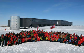 Norwegian Prime Minister Jens Stoltenberg and personnel at the geographic South Pole.