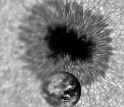 The same sunspot with the Earth to scale.