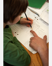 Photo of student doing math.