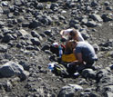 researchers working with volcanic rocks
