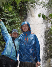 Photo of researchers Kayce Anderson and Brian Gill at a site beneath a waterfall along the Oyacachi.
