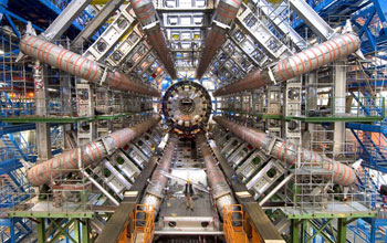 Photo showing a man standing inside the ATLAS Barrel Toroid Magnet at CERN.