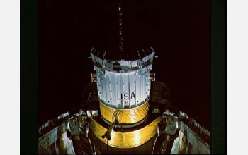 Photo of the TDRS during its deployment by the crew of the space shuttle Challenger in 1983.