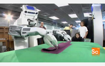 the robot PR2 folding a towel.