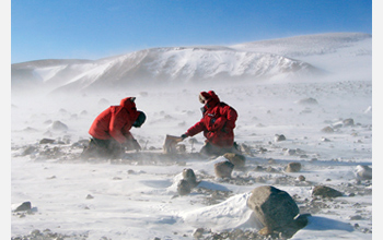 Photo of John Goodge and a colleague collecting specimens in the Transantarctic Mountains.