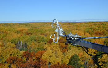 Image of a sonic aerometer close to a forest