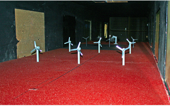 Photo showing model windmills in the tunnel that replicate the arrangement in a typical wind farm.