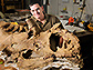 Photo of Scott Sampson with the fossil of the species Kosmoceratops richardsoni.