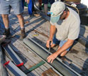 Photo of WHOI scientist Alan Gagnon preparing core samples.