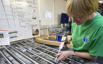 Researcher Margaret Hastedt labels pieces of core collected during Expedition 324.