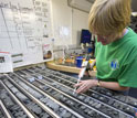 Researcher Margaret Hastedt labels pieces of core collected during Expedition 324.