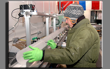 Measuring and cutting a WAIS Divide ice core at the National Ice Core Lab near Denver.
