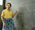 Scott Aaronson wearing a sarong while proving a theorem in his class.