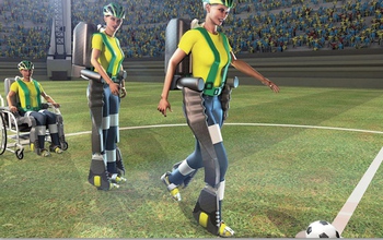 a praplegic with an exoskeleton walking to hit a soccer ball