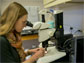 woman using a microscope