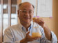 Ka-Yiu San holds a beaker of fatty acid