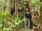 researcher standing in the forest