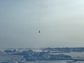 instrument being dropped through an ice opening