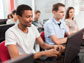 students in class working on a laptop