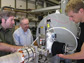 UCSD physicists inspect the apparatus