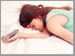a lady sleep with her smartphone in her hand