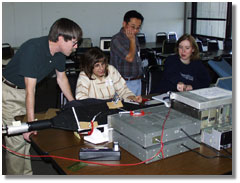 high school physics teachers assemble a cosmic ray detector; caption is below