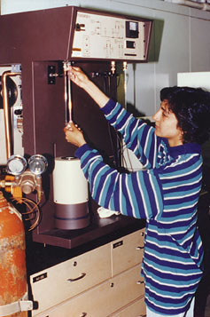 a graduate student measures the surface area of a pharmaceutical powder.