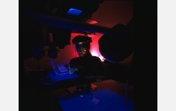 A researcher performing DNA research and protein analysis