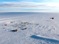 A U.S. Antarctic Program helicopter circles the Pine Island Glacier field camp.