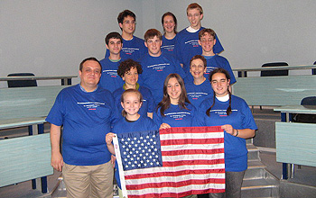 Photo of team members holding the U.S. flag