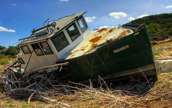 During the July 2011 La Niña, a boat sits on dry land in a branch of Lake Travis in Texas.