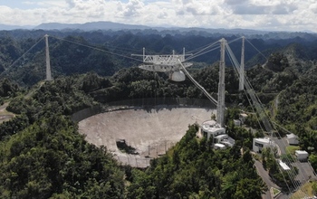 The 900-ton instrument platform at Arecibo Observatory's 305-meter telescope hanging 405 feet above the telescope's dish.