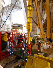Researchers prepare wellhead as part of an observatory