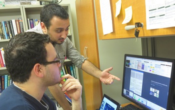 Two students at The City College of New York discuss a research project.