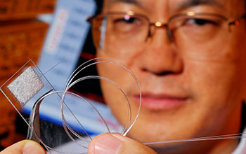 Georgia Tech Regents Professor Zhong Lin Wang holds prototype 3D solar cell