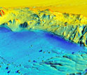 3-D post-quake rendering showing earthquake surface ruptures cutting and warping the ground.